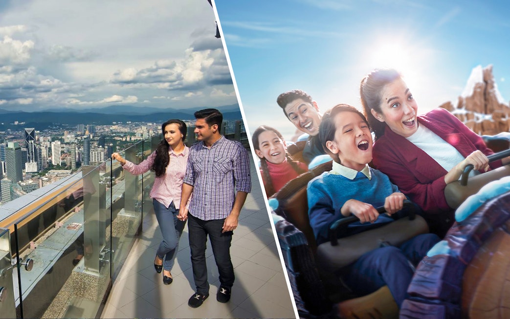 Couple enjoying city view from KL Tower observation deck, Kuala Lumpur.