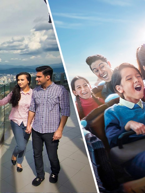 Couple enjoying city view from KL Tower observation deck, Kuala Lumpur.