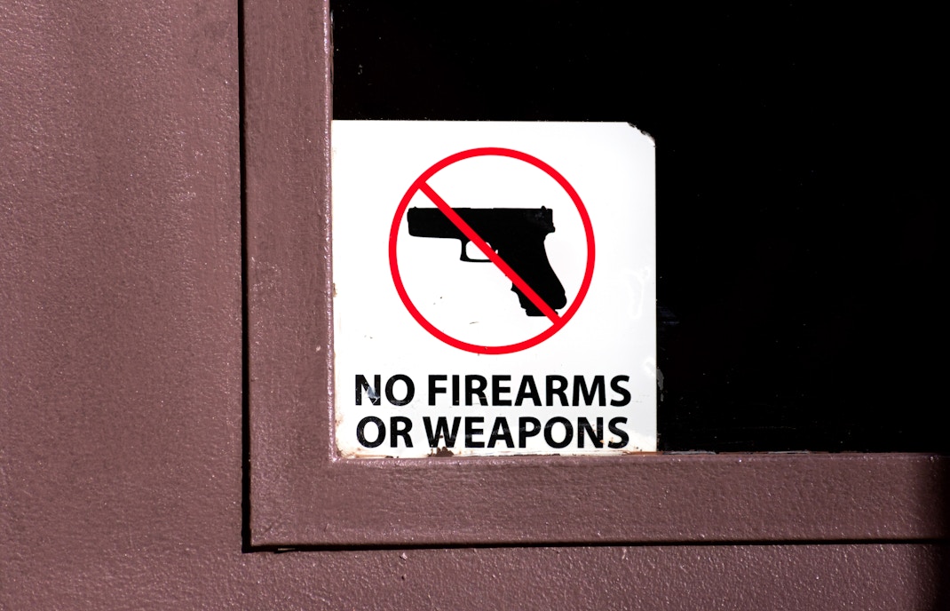 No firearms or weapons sign on a door.