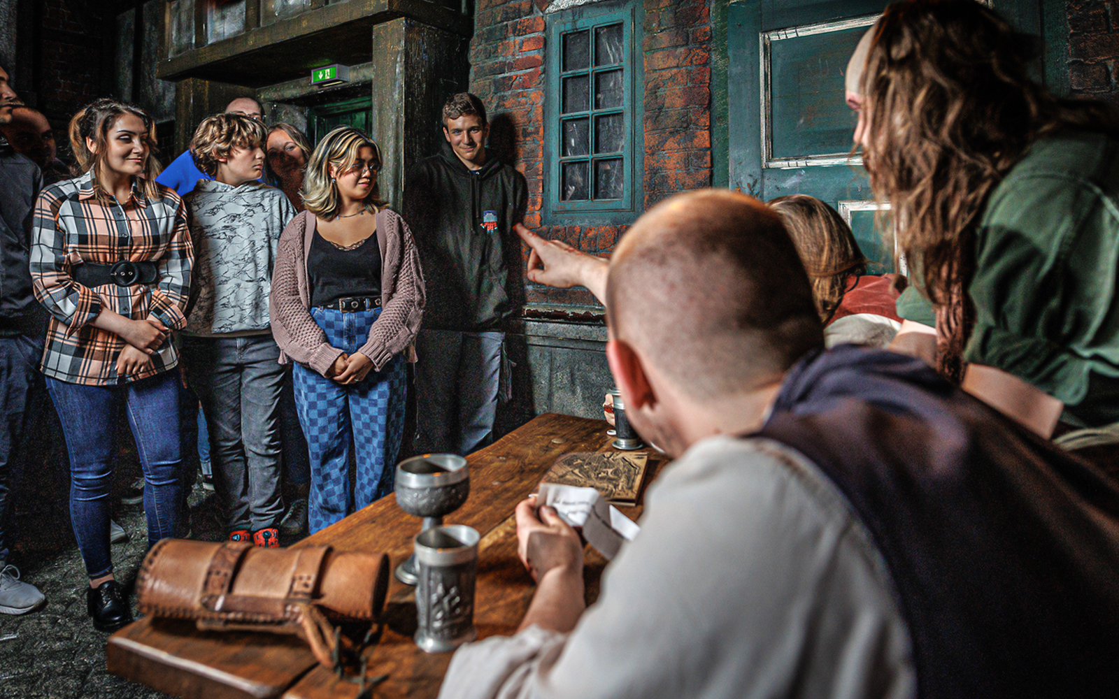 Visitors engaged in an interactive experience at Hamburg Dungeon.