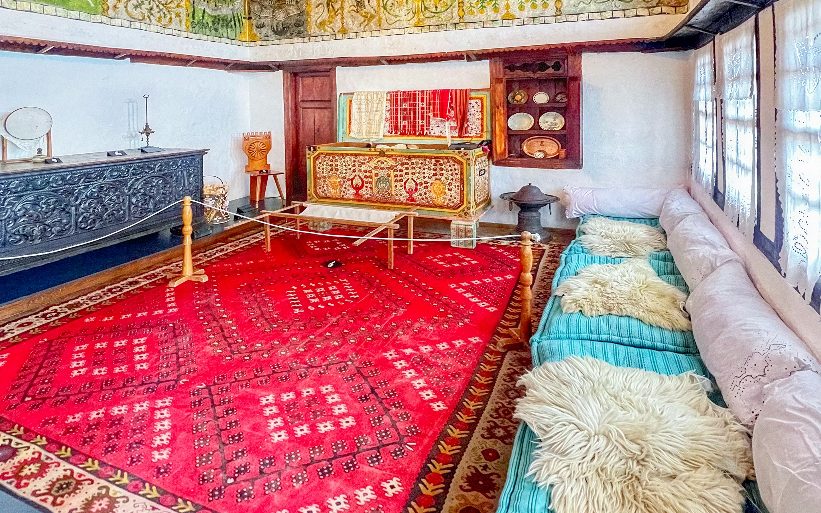 Exhibits inside Skanderbeg Museum featuring traditional Albanian decor and artifacts.