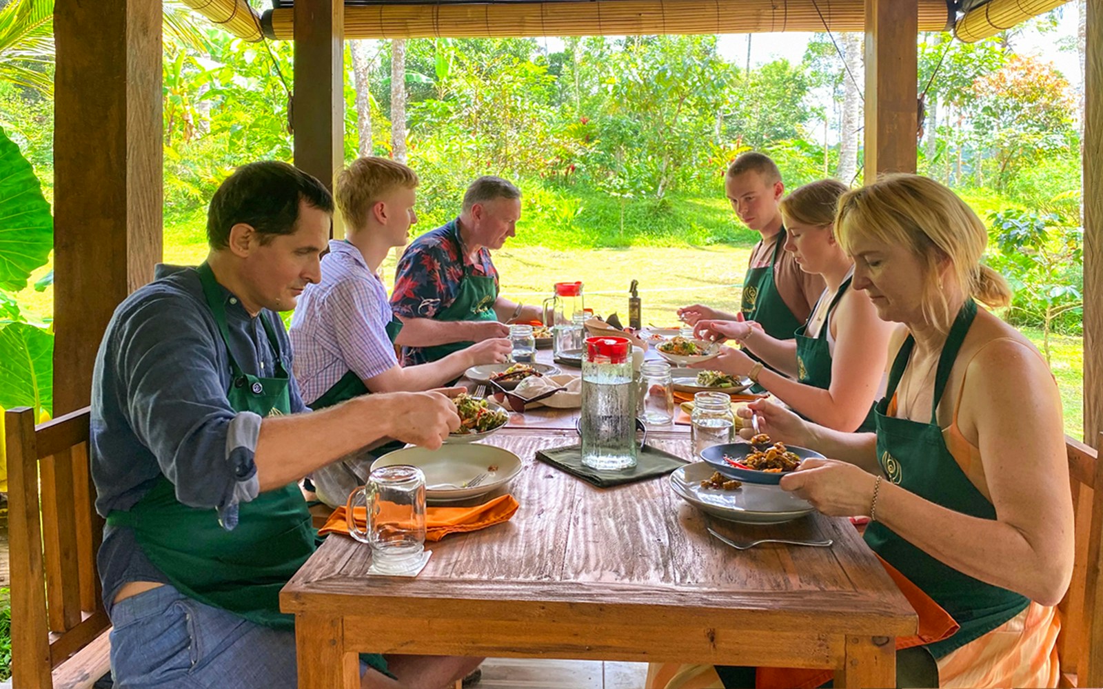 Participants enjoying a traditional Balinese meal at a Bali cooking class.
