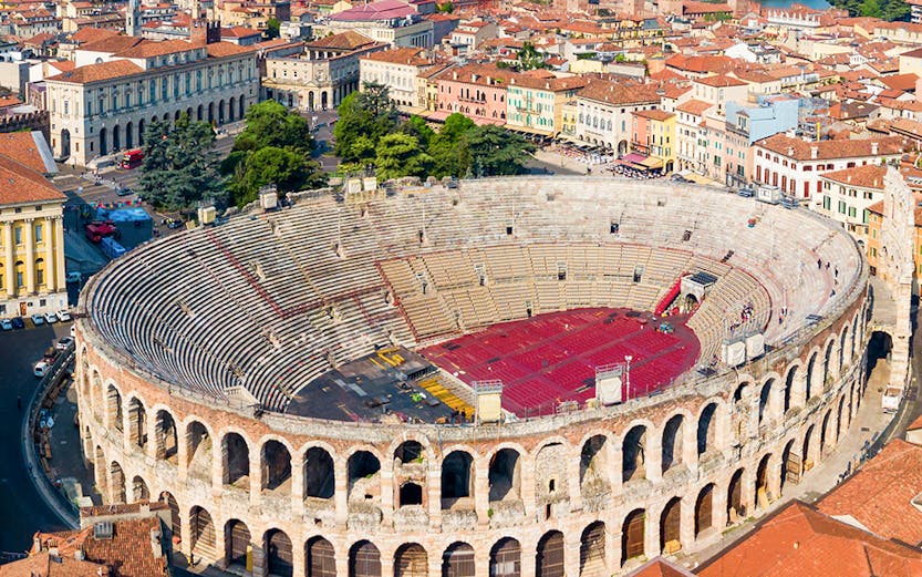 Verona Arena aerial view with surrounding cityscape in Italy.