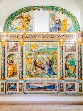 Ceramic tile mural depicting religious scene at National Tile Museum, Lisbon.