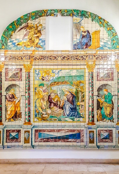 Ceramic tile mural depicting religious scene at National Tile Museum, Lisbon.