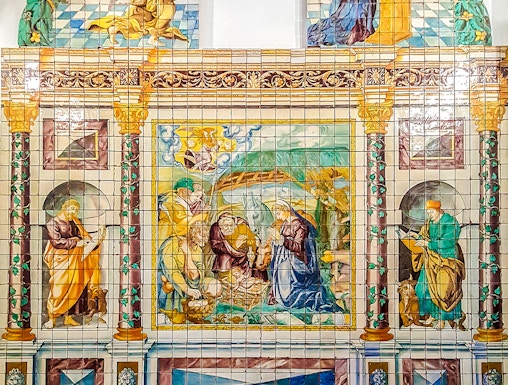 Ceramic tile mural depicting religious scene at National Tile Museum, Lisbon.