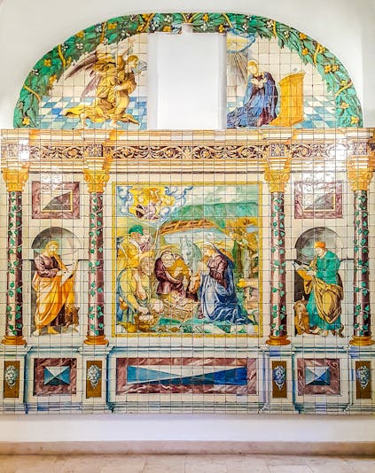 Ceramic tile mural depicting religious scene at National Tile Museum, Lisbon.