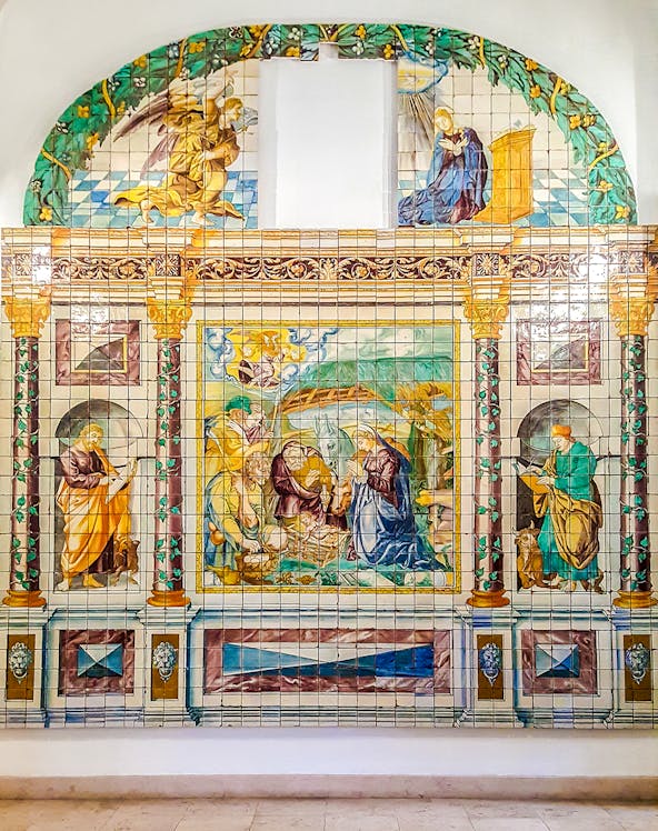 Ceramic tile mural depicting religious scene at National Tile Museum, Lisbon.