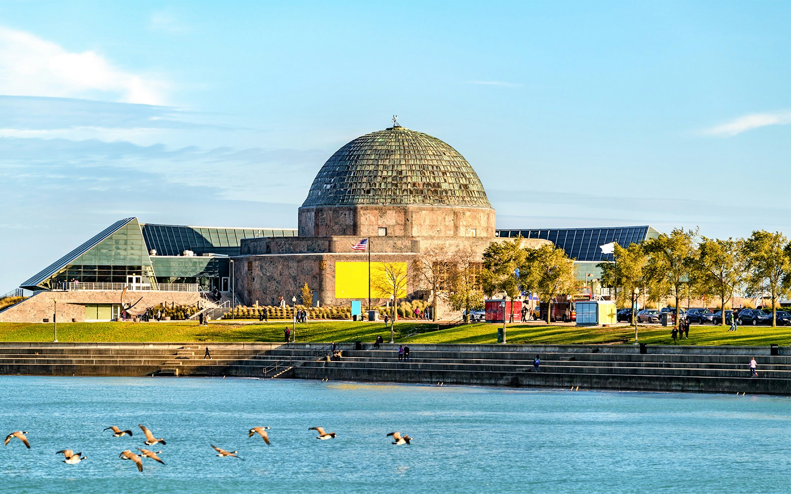 Adler Planetarium by Lake Michigan, Chicago, with Big Bus tour stop nearby.