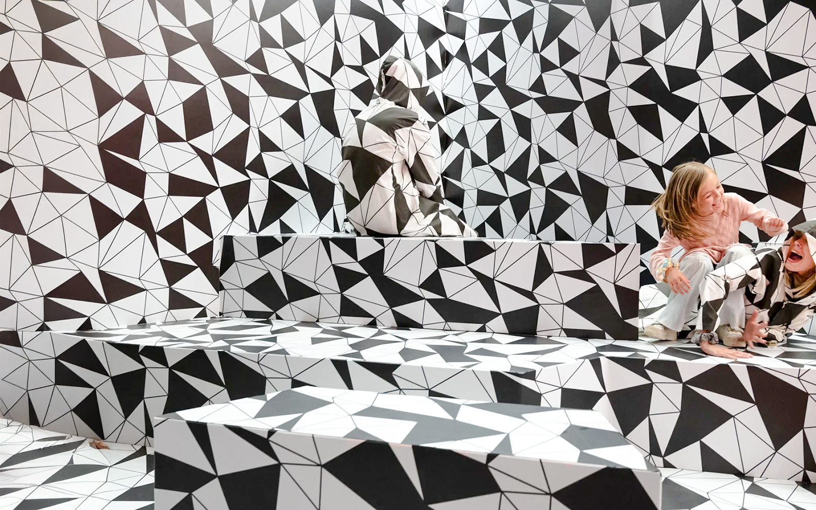 Optical illusion room with geometric patterns at Paradox Museum Paris.