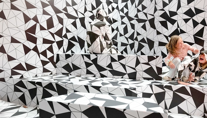 Optical illusion room with geometric patterns at Paradox Museum Paris.
