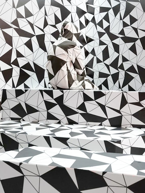 Optical illusion room with geometric patterns at Paradox Museum Paris.