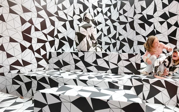 Optical illusion room with geometric patterns at Paradox Museum Paris.