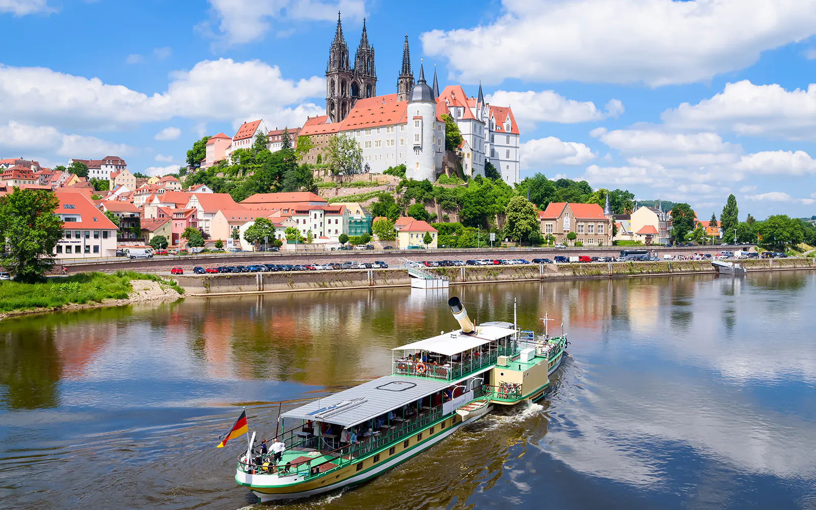 Paddle steamer on the Elbe River with Albrechtsburg Castle in Meissen in the background.