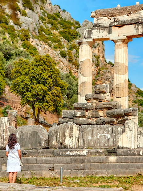 Guests exploring ancient ruins at Delphi, Greece.
