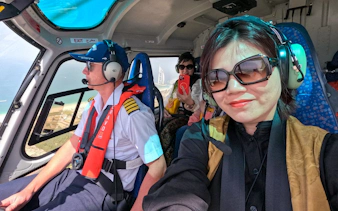 Helicopter passengers view Burj Al Arab during 17 min Dubai tour.