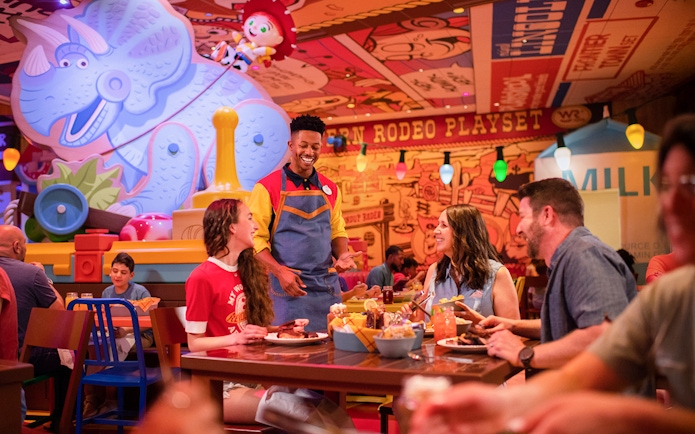Guests dining at Toy Story-themed restaurant in Walt Disney World Resort, Orlando.