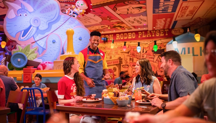 Guests dining at Toy Story-themed restaurant in Walt Disney World Resort, Orlando.