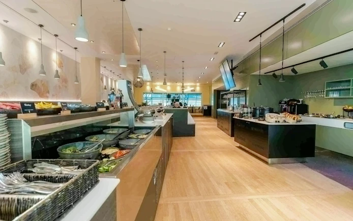 Brussels Airport Lounge interior with buffet and seating area.