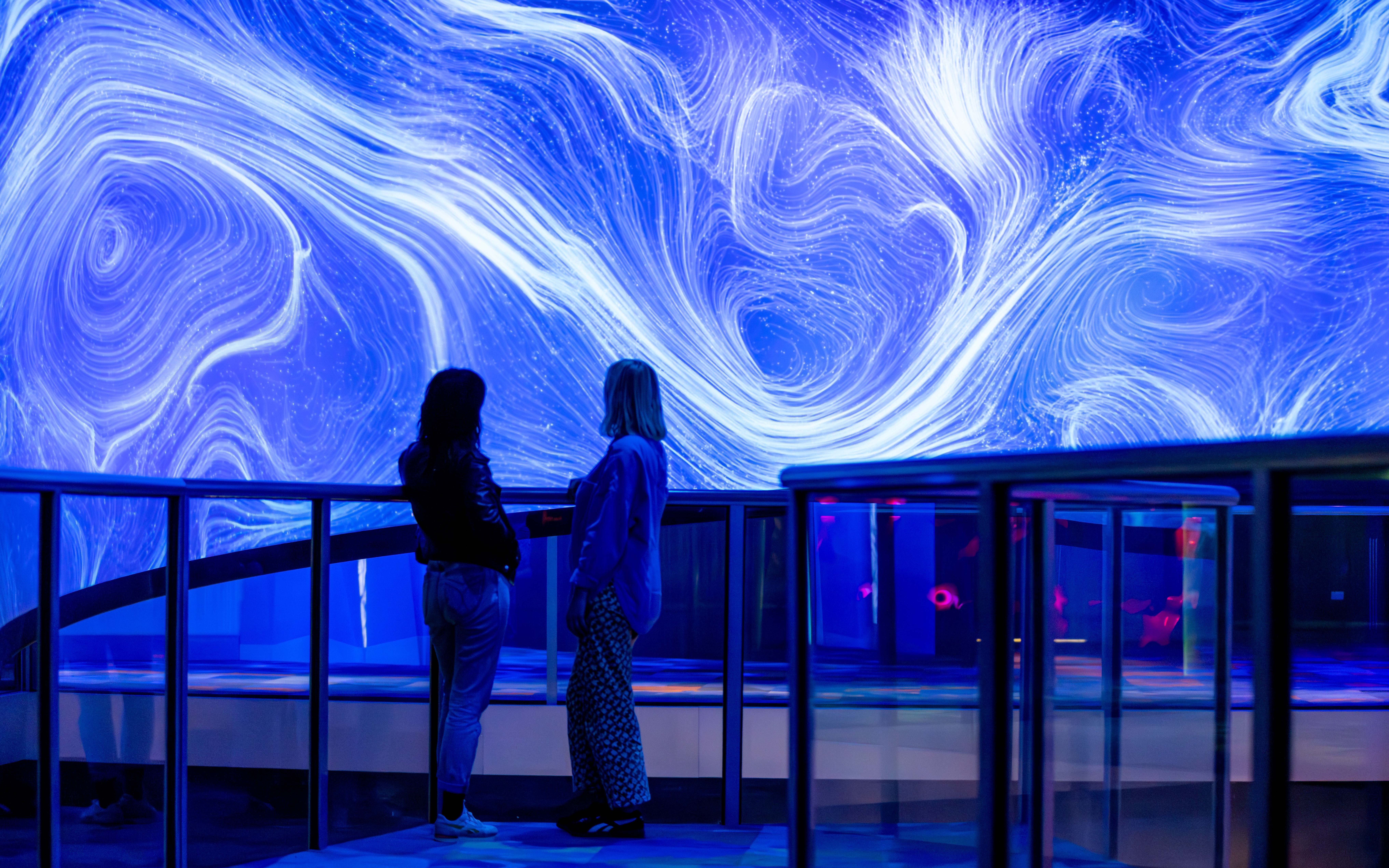 Visitors viewing "Our Wondrous Planet" exhibit at Melbourne Museum.