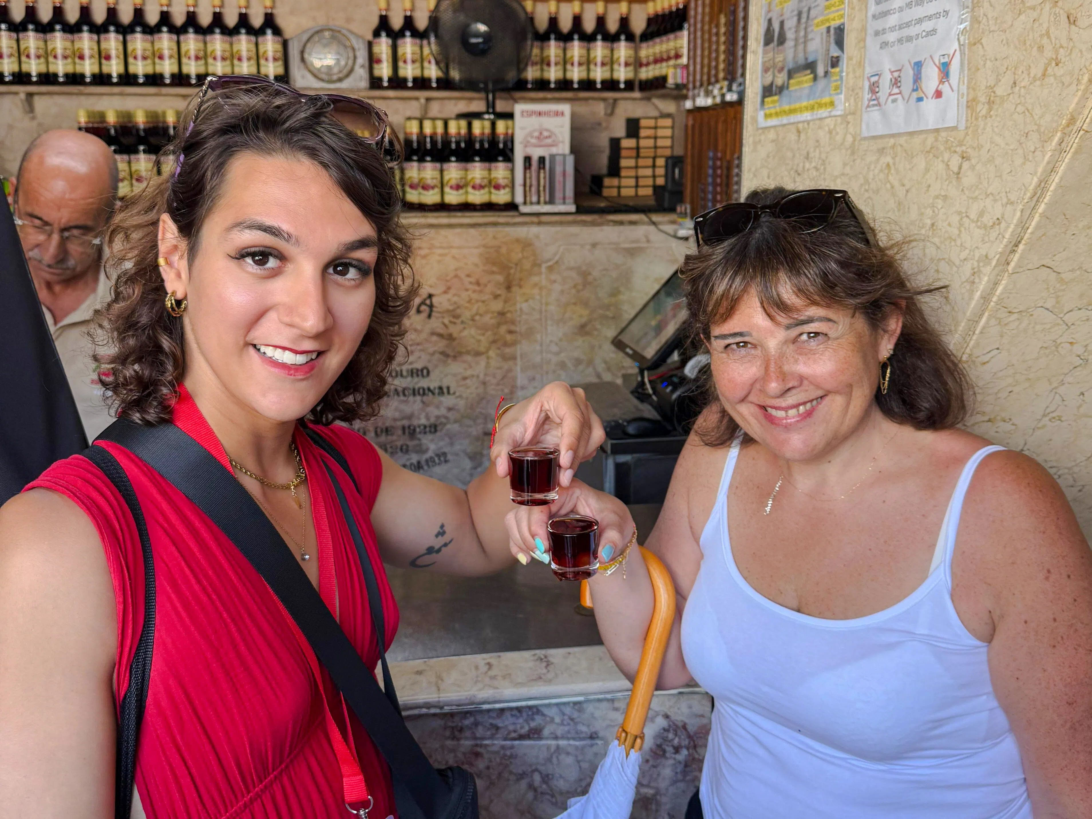 Participants enjoying a vegan wine tasting in Lisbon shop.
