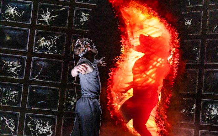Person with VR headset facing fiery portal, inspired by Stranger Things.