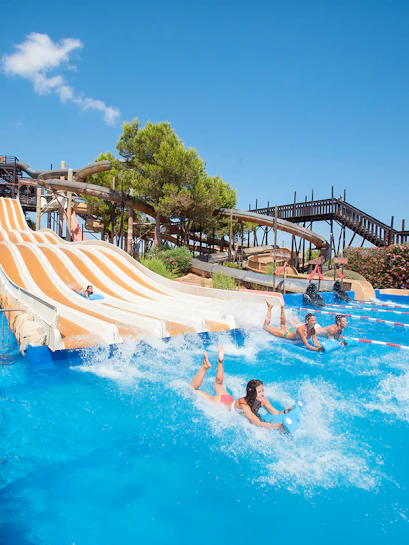 Visitors enjoying water slides at Western Water Park, Mallorca.