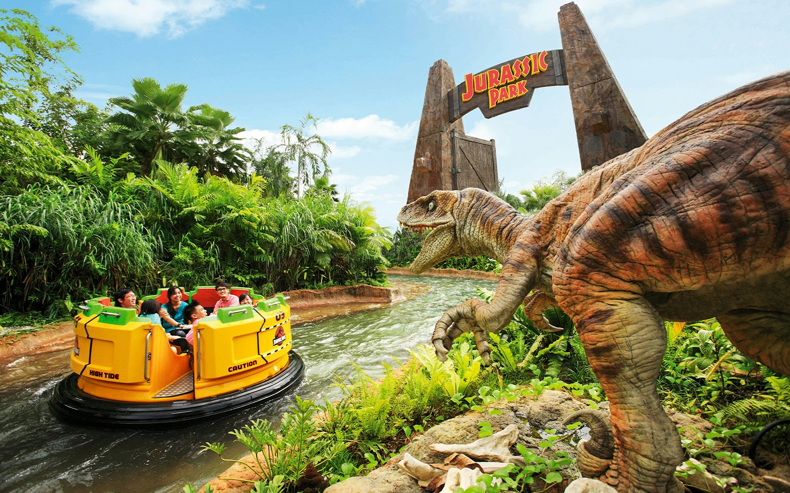Visitors on Jurassic Park Rapids Adventure ride at Universal Studios Singapore, with dinosaur and jungle scenery.