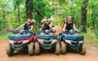 Group enjoying ATV ride through lush Krabi jungle on nature escape tour.