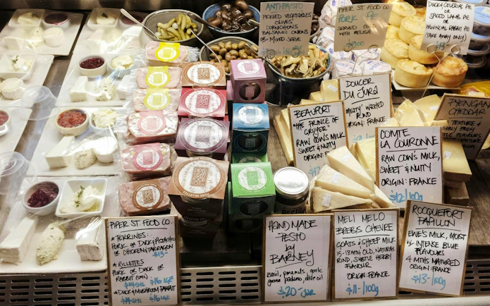Cheese and charcuterie selection at Yarra Valley winery tour, featuring local and French varieties.