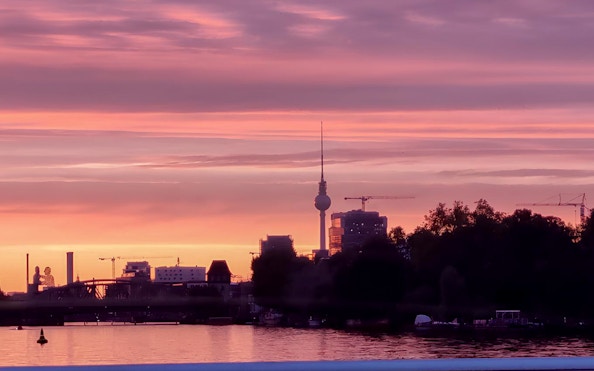 Berlin TV Tower at sunset during an evening sightseeing cruise.