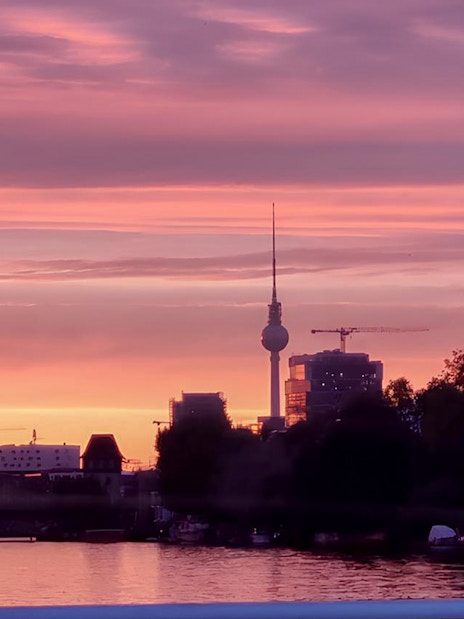 Berlin TV Tower at sunset during an evening sightseeing cruise.