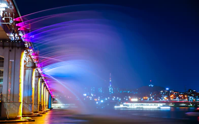 Banpo Bridge Rainbow Fountain at night with Eland Cruise on Han River, Seoul.