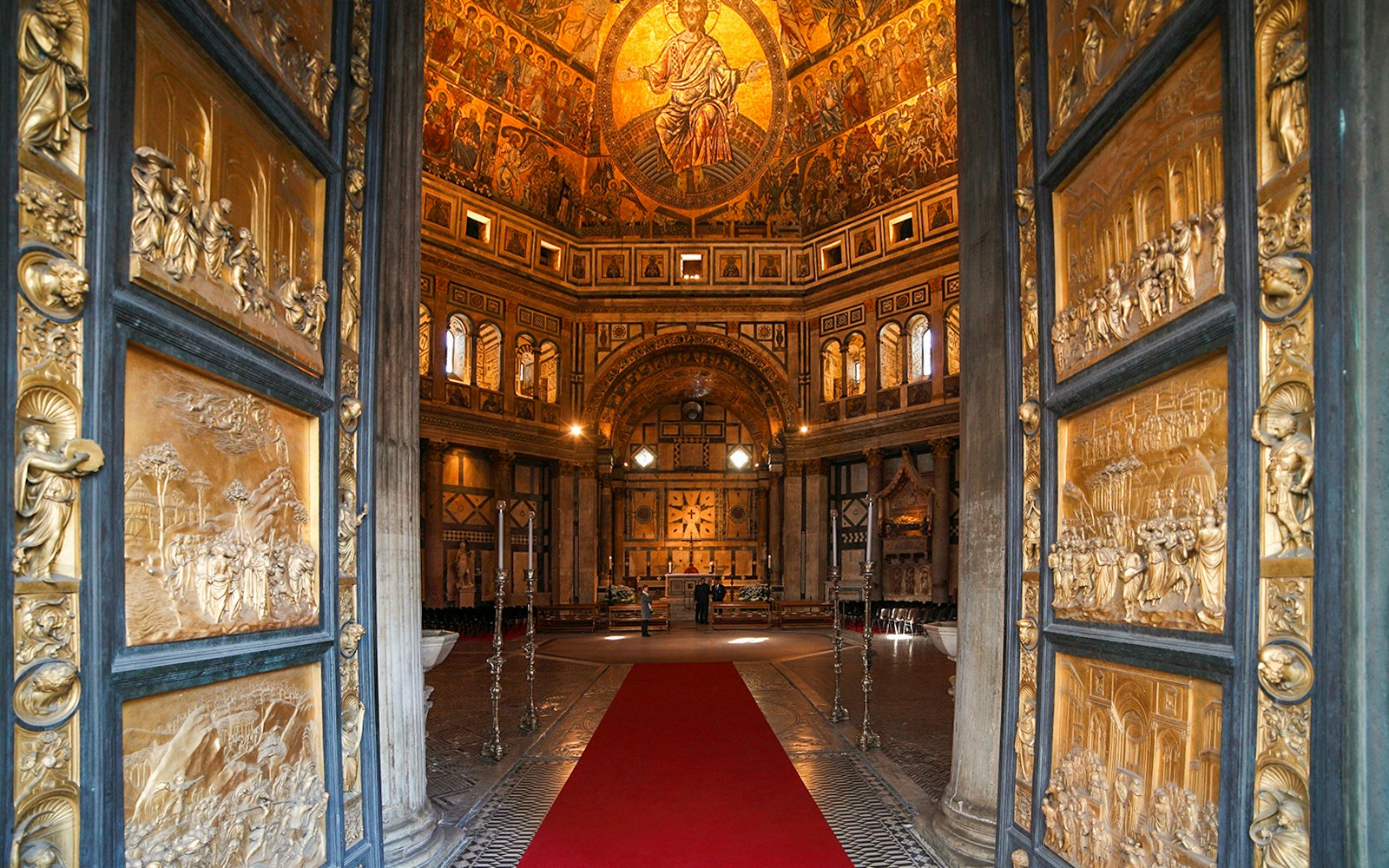 Florence Baptistery interior with mosaic ceiling and ornate doors, part of Florence Half-Day Guided Tour.