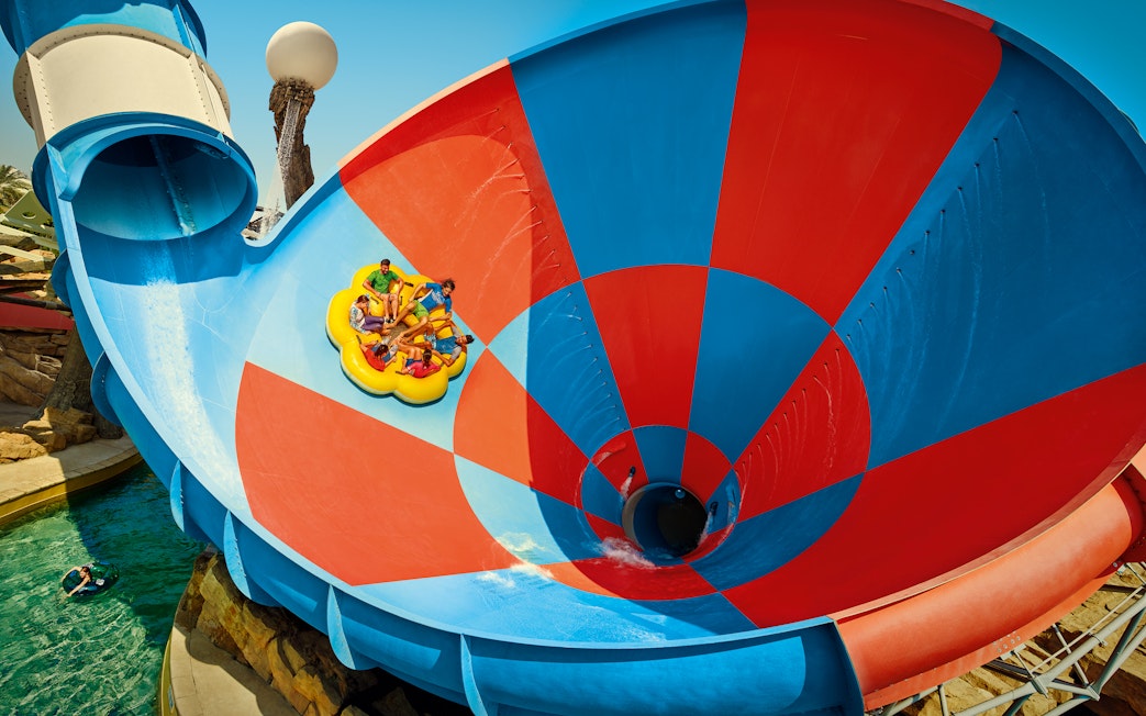Rafting on Dawwama spiral water slide at YAS Waterworld, Abu Dhabi.