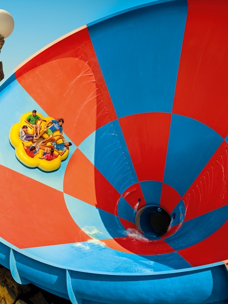 Rafting on Dawwama spiral water slide at YAS Waterworld, Abu Dhabi.