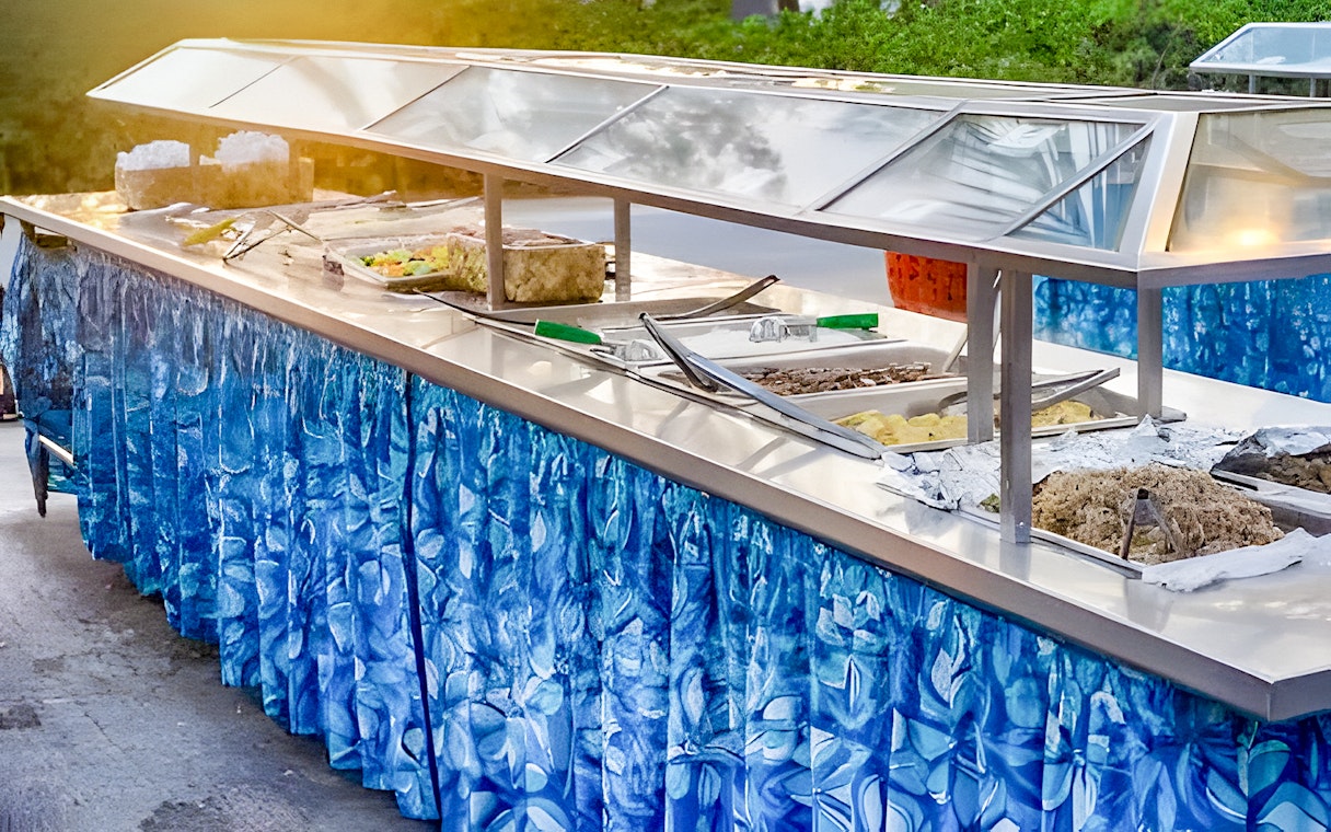 Buffet setup with traditional Polynesian dishes at Germaine's Luau.