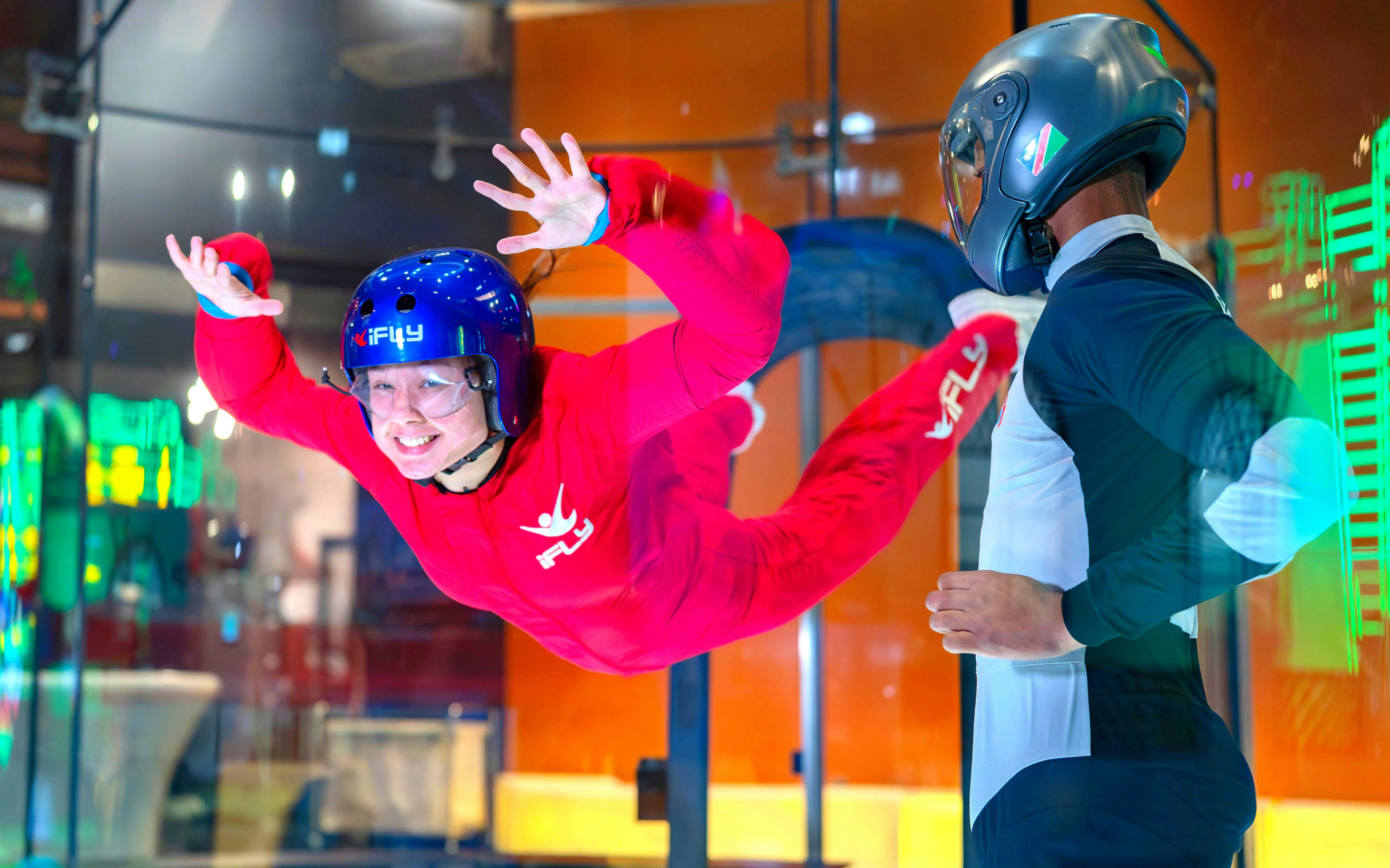 Indoor skydiving experience at iFLY with instructor guidance.