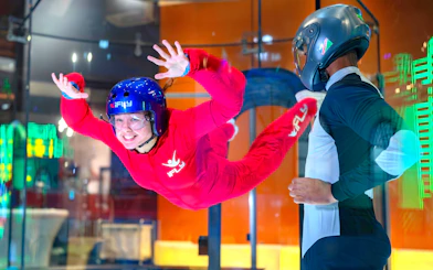 Indoor skydiving experience at iFLY with instructor guidance.