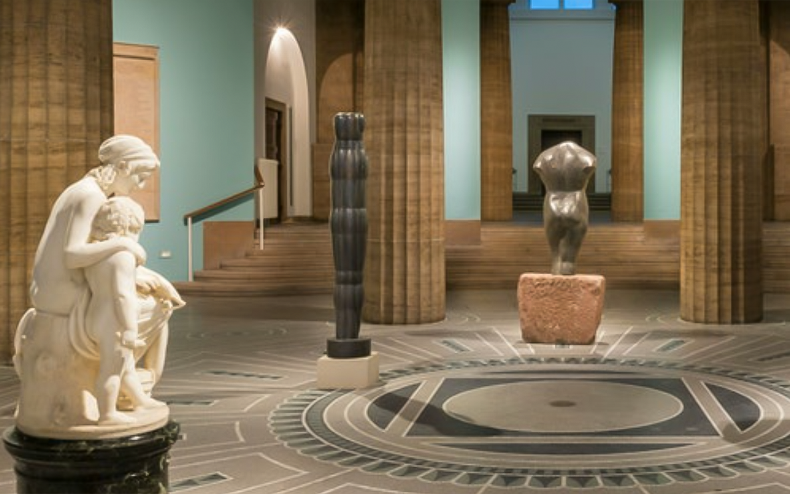 Exhibits inside Hamburger Kunsthalle featuring sculptures and architectural details.