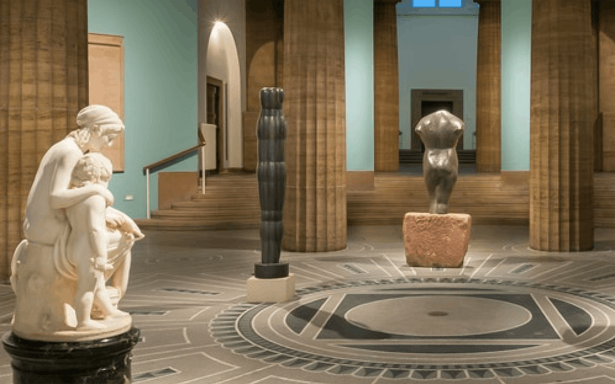 Exhibits inside Hamburger Kunsthalle featuring sculptures and architectural details.