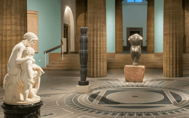 Exhibits inside Hamburger Kunsthalle featuring sculptures and architectural details.