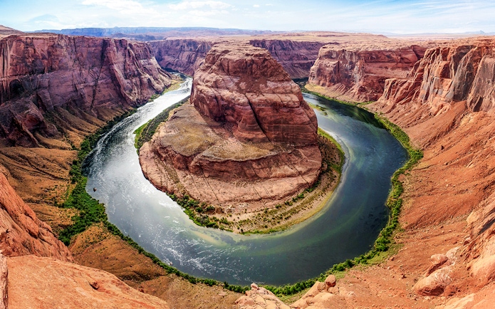 Horseshoe Bend in Arizona with the Colorado River curving around red rock formations.