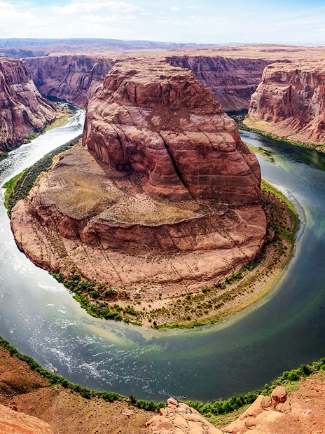 Horseshoe Bend in Arizona with the Colorado River curving around red rock formations.
