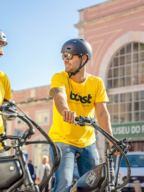 Tour guides on electric bikes outside Museu do Fado, Lisbon.