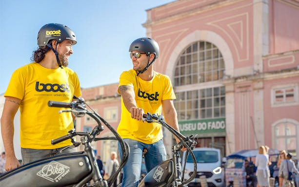 Tour guides on electric bikes outside Museu do Fado, Lisbon.