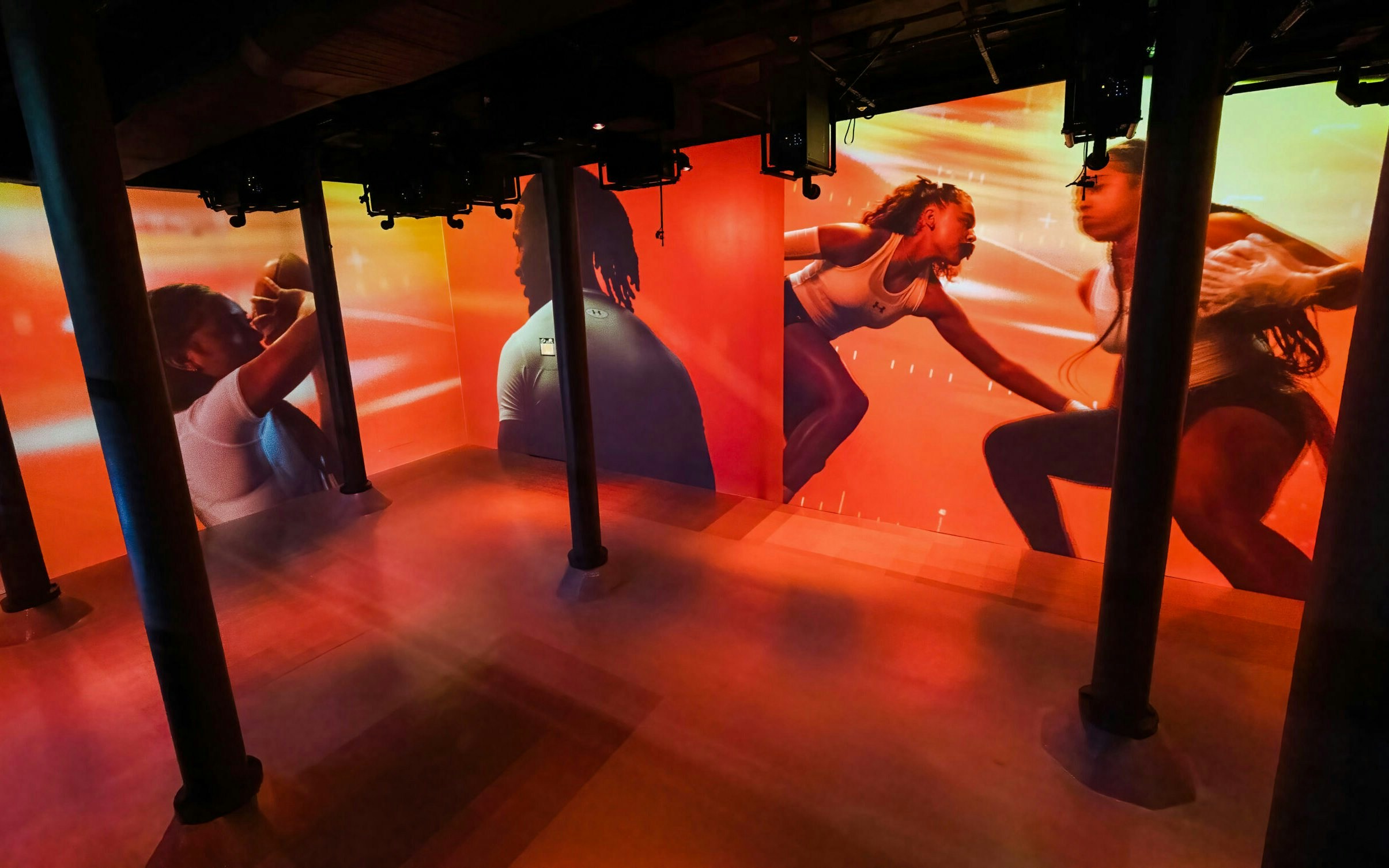 Immersive digital art installation at ARTECHOUSE New York with dynamic visuals on walls.