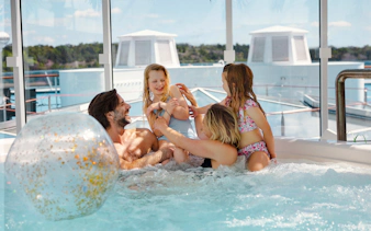 Family enjoying a hot tub on an overnight ferry to Helsinki.