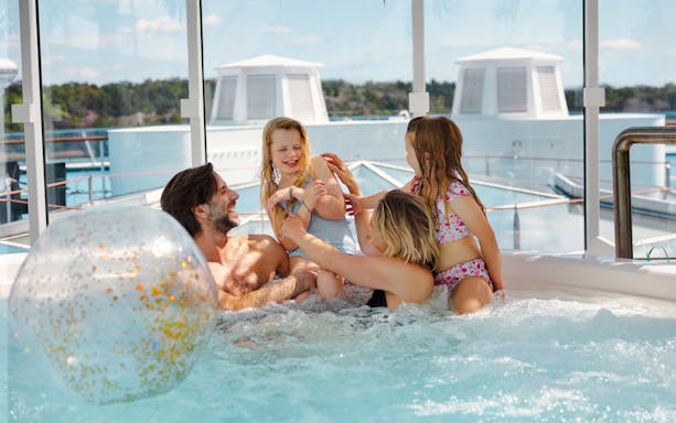 Family enjoying a hot tub on an overnight ferry to Helsinki.