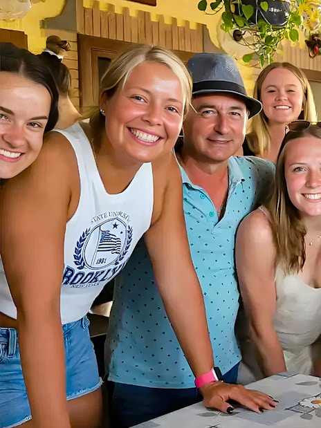 Group enjoying Amalfi Coast cooking class, learning to make tiramisù, mozzarella, and pasta.